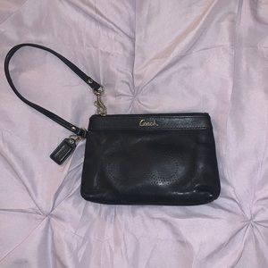 Coach leather perforated wristlet.